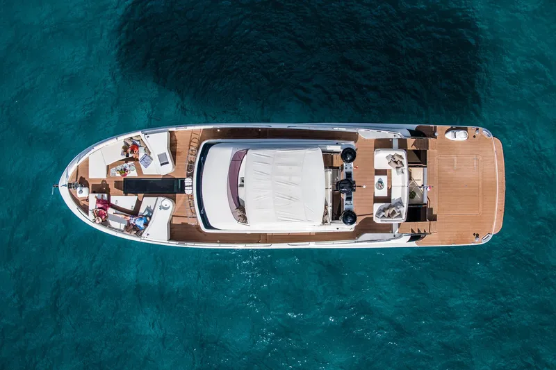 Slide: The Image of Aerial view of 2025 Van der Valk BeachClub 660 Flybridge yacht on clear blue water. - 9
