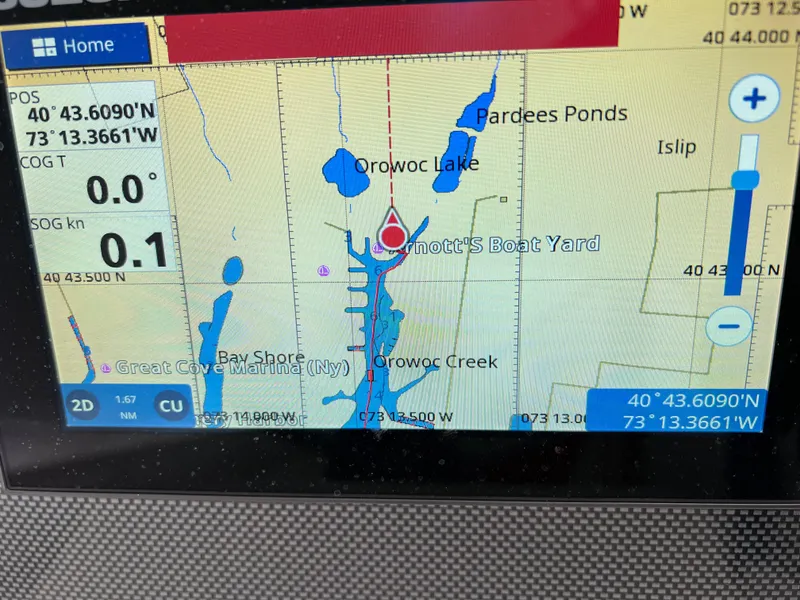 Slide: The Image of GPS navigation screen on a 1994 Wellcraft 302 SCARAB SPORT boat, showing Orowoc Lake area. - 13