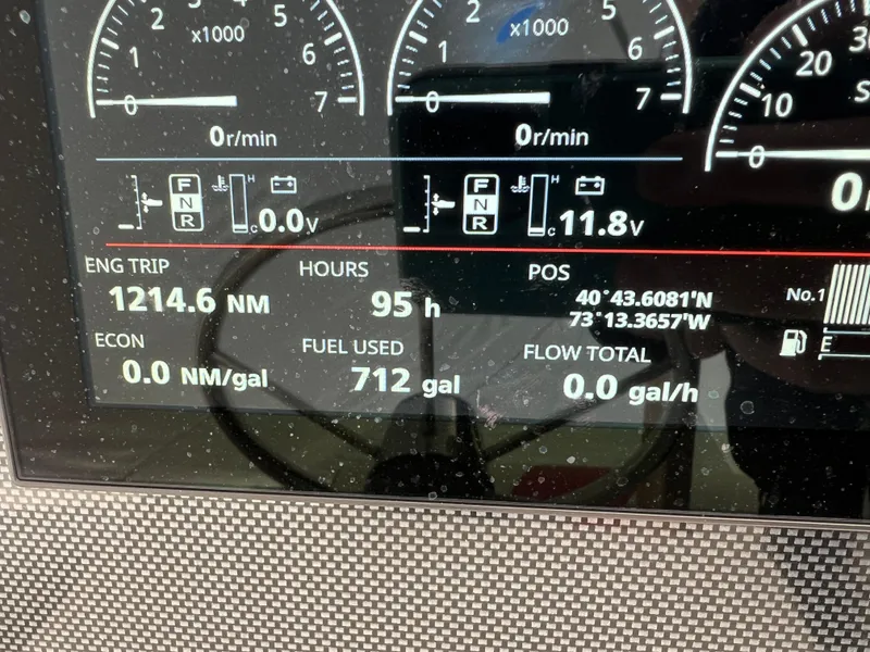 Slide: The Image of Dashboard of a 1994 Wellcraft 302 SCARAB SPORT showing engine data and fuel usage. - 14