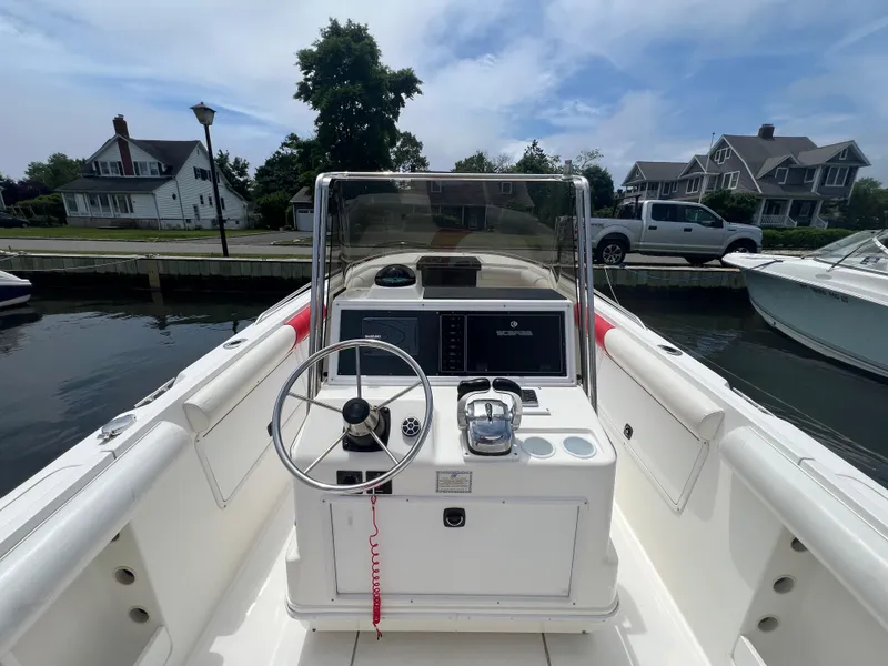 Slide: The Image of 1994 Wellcraft 302 Scarab Sport boat interior with steering wheel and control panel. - 6
