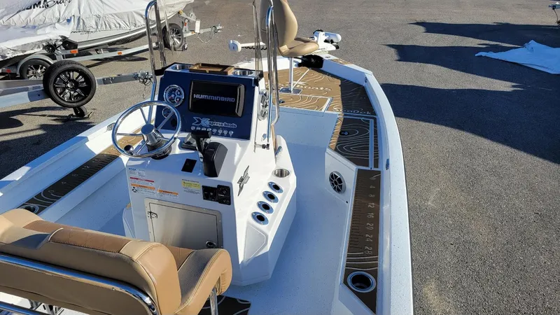 Slide: The Image of 2025 Xpress H20 Bay boat with Yamaha Vmax 150, featuring modern console and seating. - 12