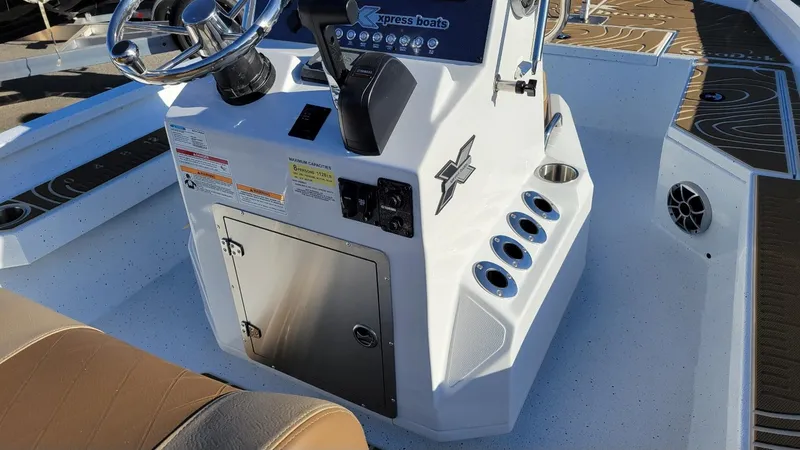 Slide: The Image of 2025 Xpress H20 Bay boat console with Yamaha Vmax 150, featuring steering and controls. - 13