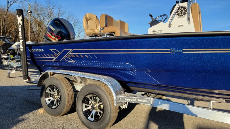 Slide: The Image of 2025 Xpress H20 Bay boat with Yamaha Vmax 150 engine on trailer. - 14