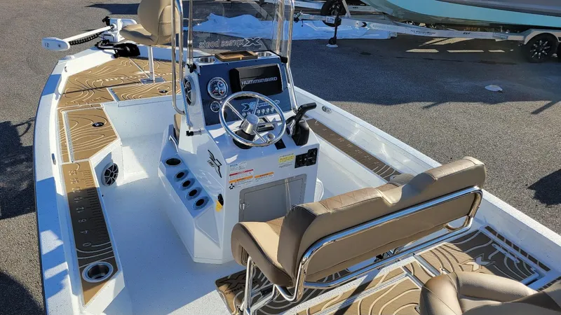 Slide: The Image of 2025 Xpress H20 Bay boat with Yamaha Vmax 150, featuring modern console and seating. - 16
