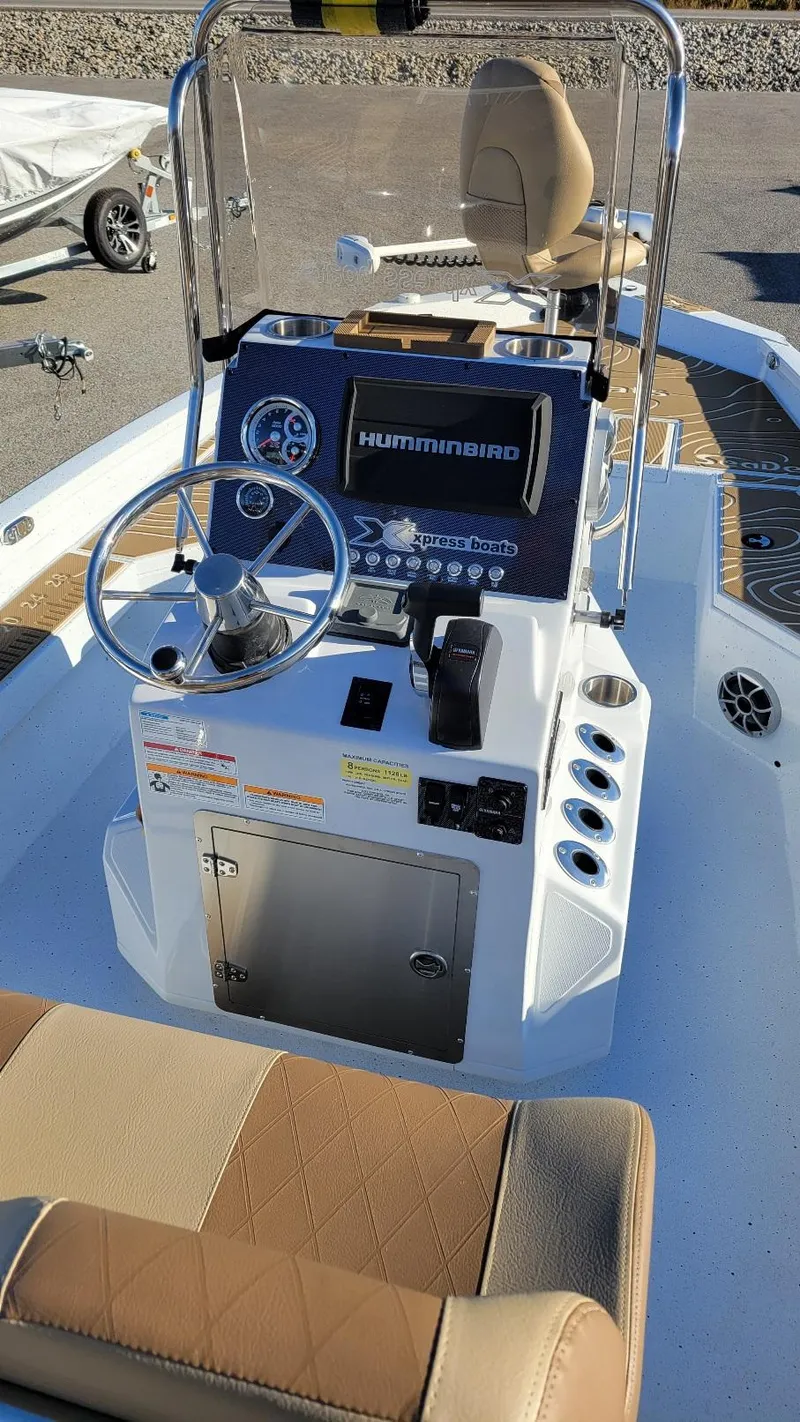 Slide: The Image of 2025 Xpress H20 Bay boat interior with Yamaha Vmax 150, featuring Humminbird electronics. - 20