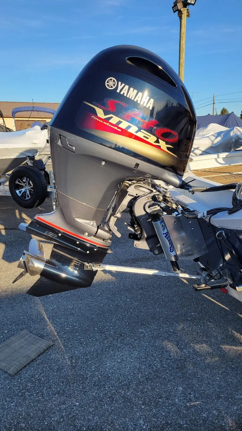 Slide: The Image of 2025 Xpress H20 Bay with Yamaha Vmax 150 outboard motor, parked outdoors. - 3