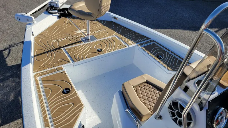 Slide: The Image of 2025 Xpress H20 Bay boat interior with Yamaha Vmax 150, featuring stylish seating and deck design. - 4
