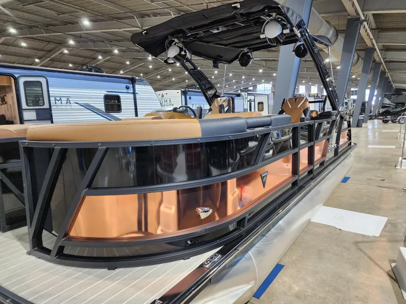 Slide: The Image of 2024 Trifecta 23 RF SS With Arch pontoon boat on display indoors. - 0