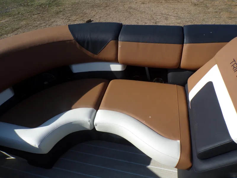 Slide: The Image of 2024 Trifecta 23 RF SS With Arch boat seating area, brown and white upholstery. - 12