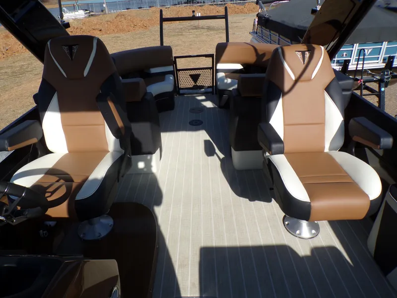 Slide: The Image of 2024 Trifecta 23 RF SS With Arch boat interior, featuring brown and white seating. - 19
