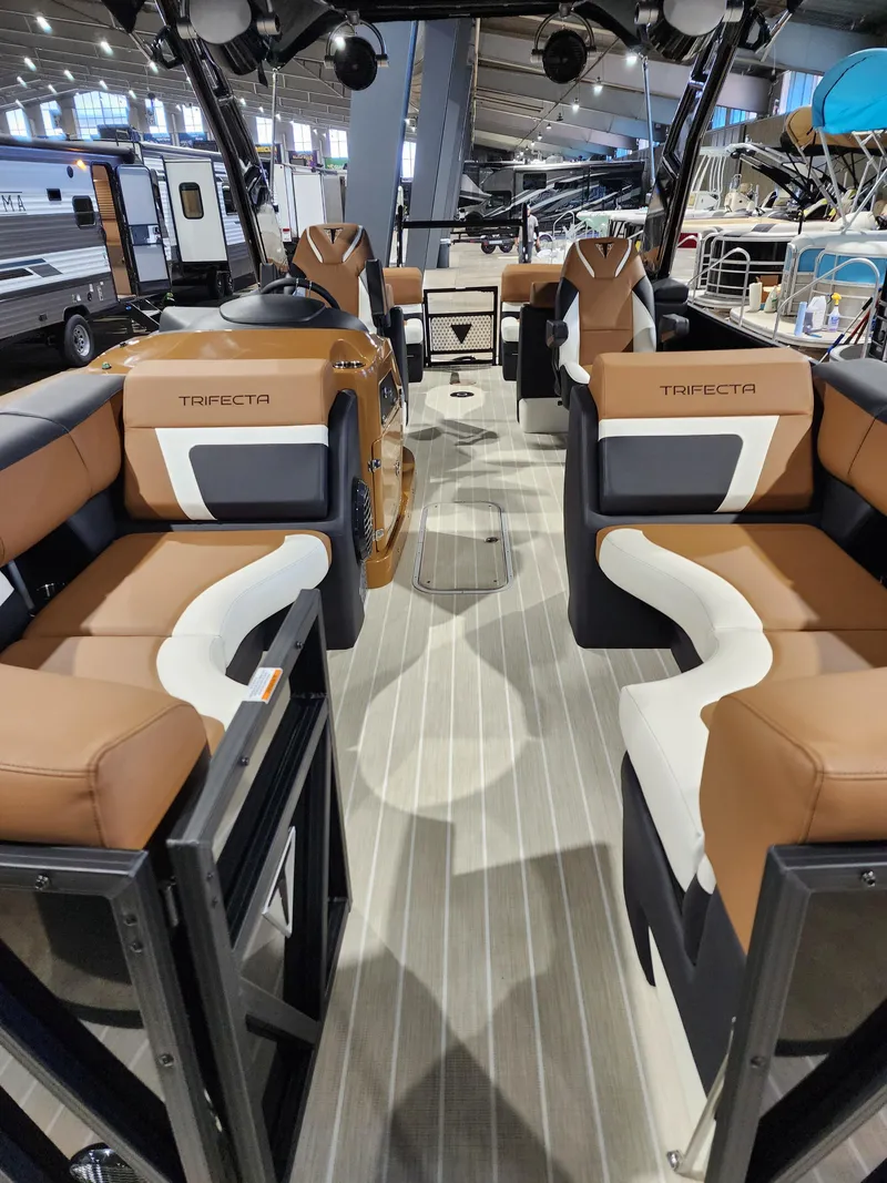 Slide: The Image of 2024 Trifecta 23 RF SS With Arch pontoon boat interior, featuring luxurious seating and modern design. - 2