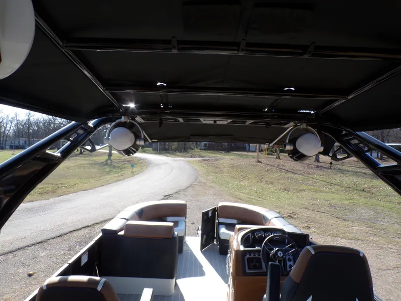 Slide: The Image of 2024 Trifecta 23 RF SS With Arch interior view, showcasing seating and control console. - 28