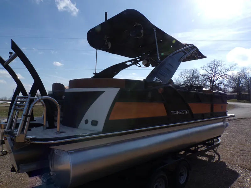 Slide: The Image of 2024 Trifecta 23 RF SS With Arch pontoon boat on a trailer. - 33