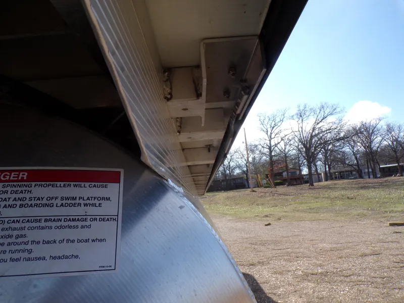 Slide: The Image of Close-up of the underside of a 2024 Trifecta 23 RF SS With Arch pontoon boat. - 37