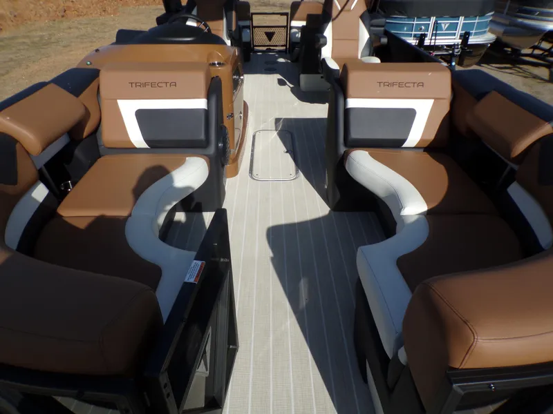 Slide: The Image of 2024 Trifecta 23 RF SS With Arch interior, featuring luxurious brown and white seating. - 42