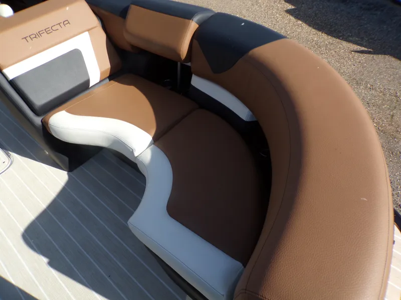 Slide: The Image of 2024 Trifecta 23 RF SS With Arch boat interior seating, brown and white upholstery. - 43