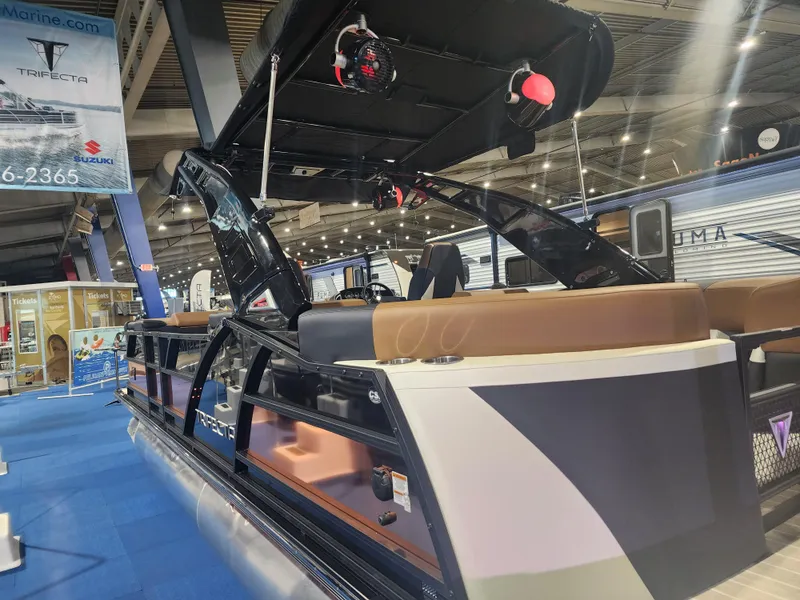 Slide: The Image of 2024 Trifecta 23 RF SS With Arch pontoon boat displayed indoors. - 6