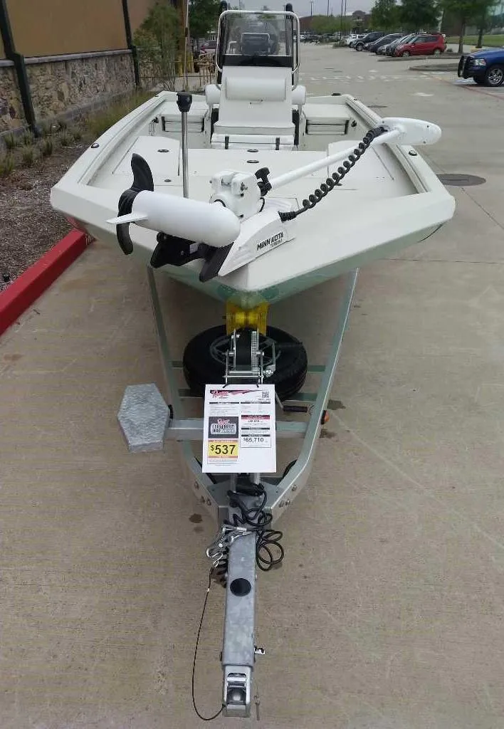 Slide: The Image of 2024 Ranger RB210 fishing boat on trailer in parking lot. - 1