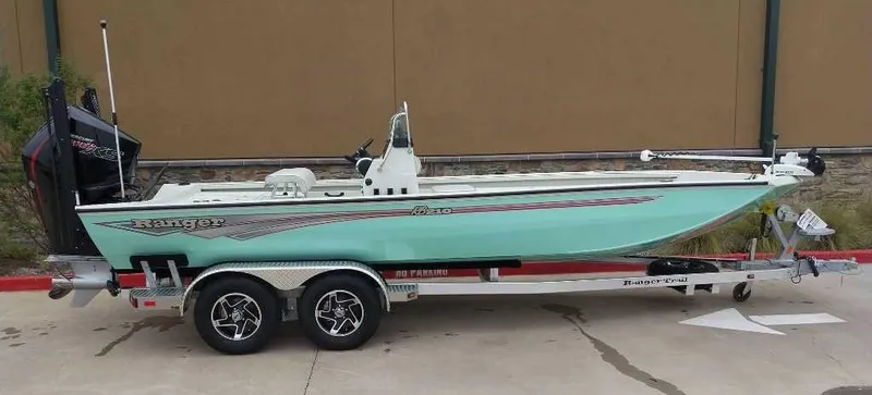 Slide: The Image of 2024 Ranger RB210 boat on a trailer, side view. - 2