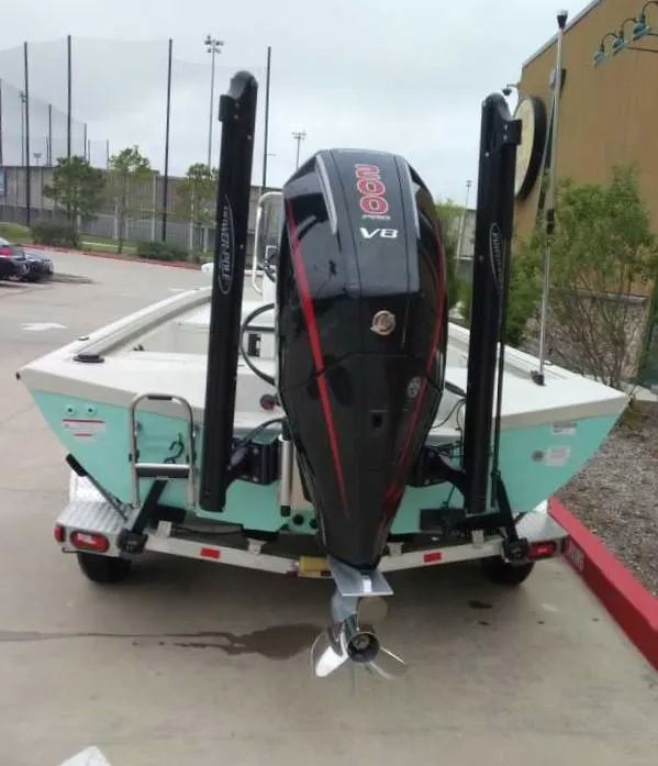 Slide: The Image of 2024 Ranger RB210 boat with a powerful V8 engine on a trailer. - 3