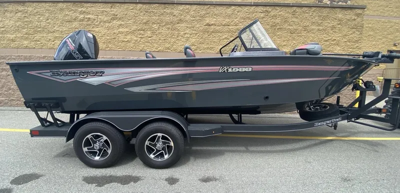 The Image of 2024 Ranger VX1988 WT boat on trailer, sleek design, dual-axle wheels, outdoor setting. - 0