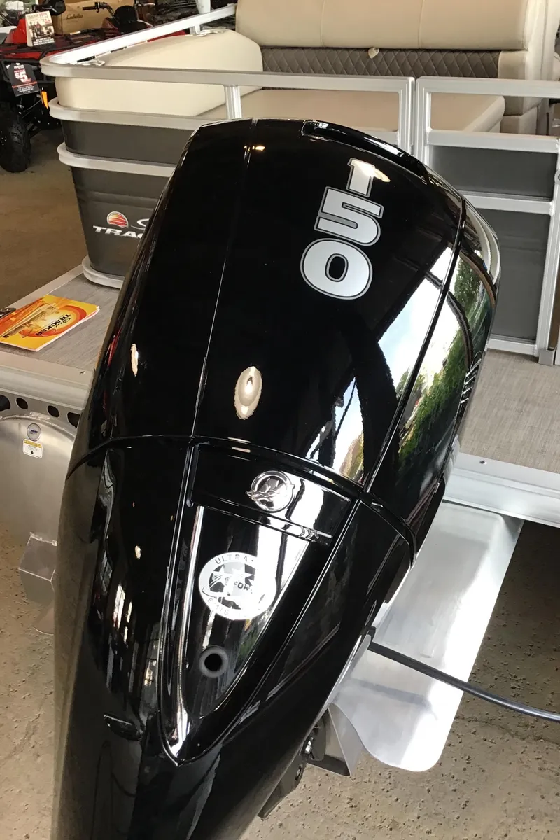 Slide: The Image of 2024 Sun Tracker Party Barge 22 RF DLX with powerful 150 HP outboard motor. - 4