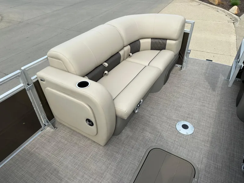 Slide: The Image of 2024 Sun Tracker SportFish 22 XP3 pontoon boat with beige seating. - 3