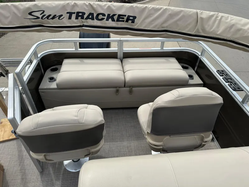 Slide: The Image of 2024 Sun Tracker SportFish 22 XP3 boat interior with seating and cup holders. - 6