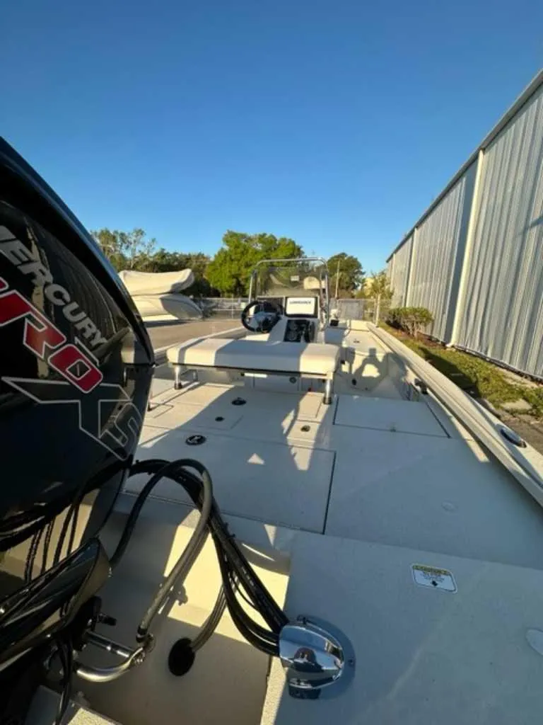 Slide: The Image of 2024 Ranger RB190 boat with Mercury Pro XS engine, docked outdoors. - 2