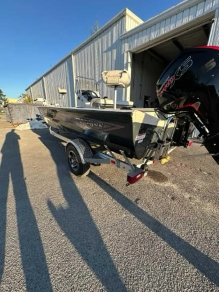 Slide: The Image of 2024 Ranger RB190 boat parked outside a metal building. - 5