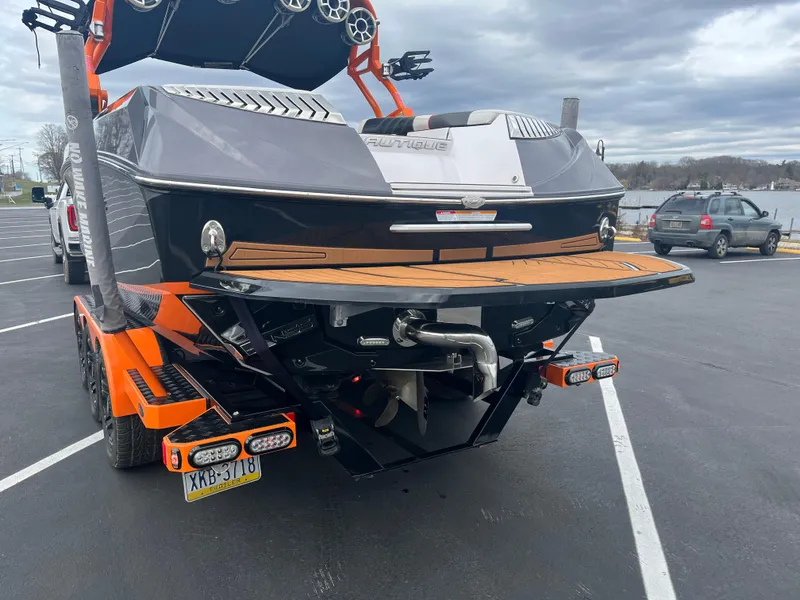 Slide: The Image of 2013 Nautique G23 boat on trailer in parking lot. - 5