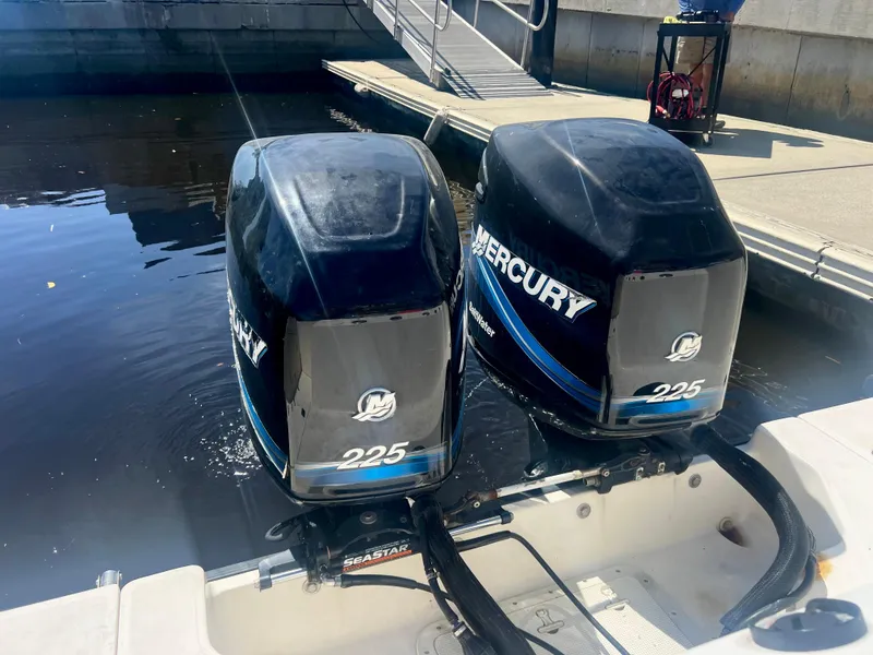 Slide: The Image of Twin Mercury 225 outboard engines on a 2003 Boston Whaler 290 Outrage boat. - 11