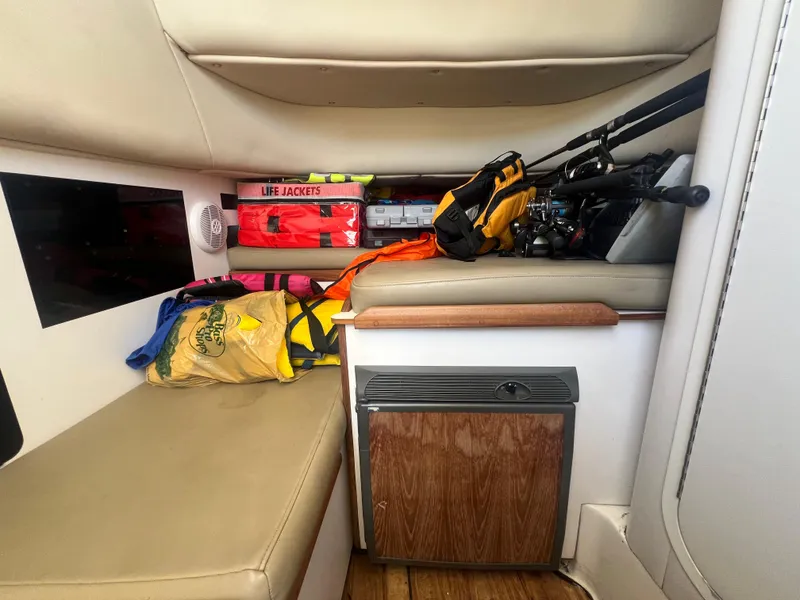 Slide: The Image of Interior of a 2003 Boston Whaler 290 Outrage with fishing gear and life jackets. - 14