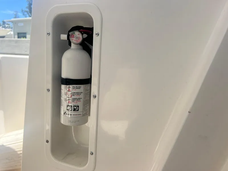 Slide: The Image of Fire extinguisher mounted on a 2003 Boston Whaler 290 Outrage boat. - 25
