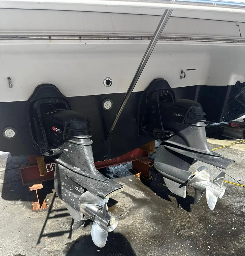 Slide: The Image of 2006 Four Winns 328 Vista boat with dual outboard motors in dry dock. - 10