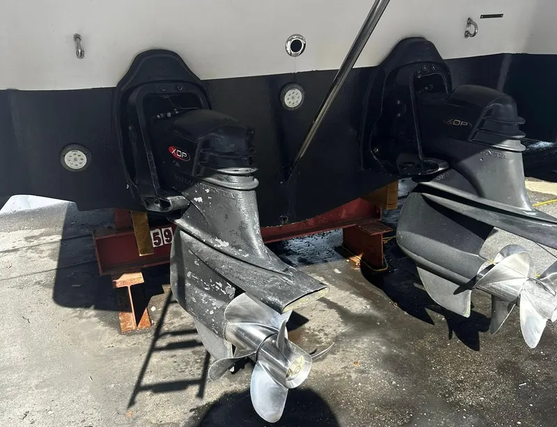 Slide: The Image of 2006 Four Winns 328 Vista boat propellers and stern drives in dry dock. - 11