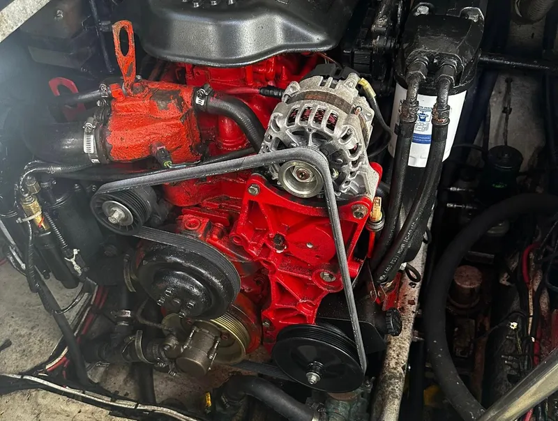 Slide: The Image of 2006 Four Winns 328 Vista engine compartment with red engine components. - 12