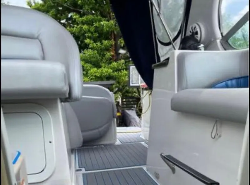 Slide: The Image of 2006 Four Winns 328 Vista boat interior with gray seating and blue accents. - 14