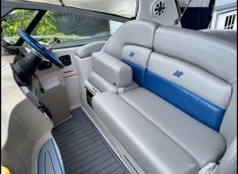 Slide: The Image of 2006 Four Winns 328 Vista boat interior with blue and white seating. - 15