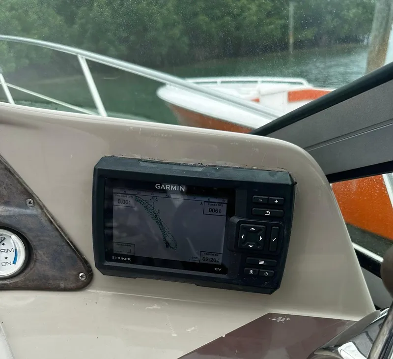 Slide: The Image of Garmin navigation system on 2006 Four Winns 328 Vista boat dashboard. - 22