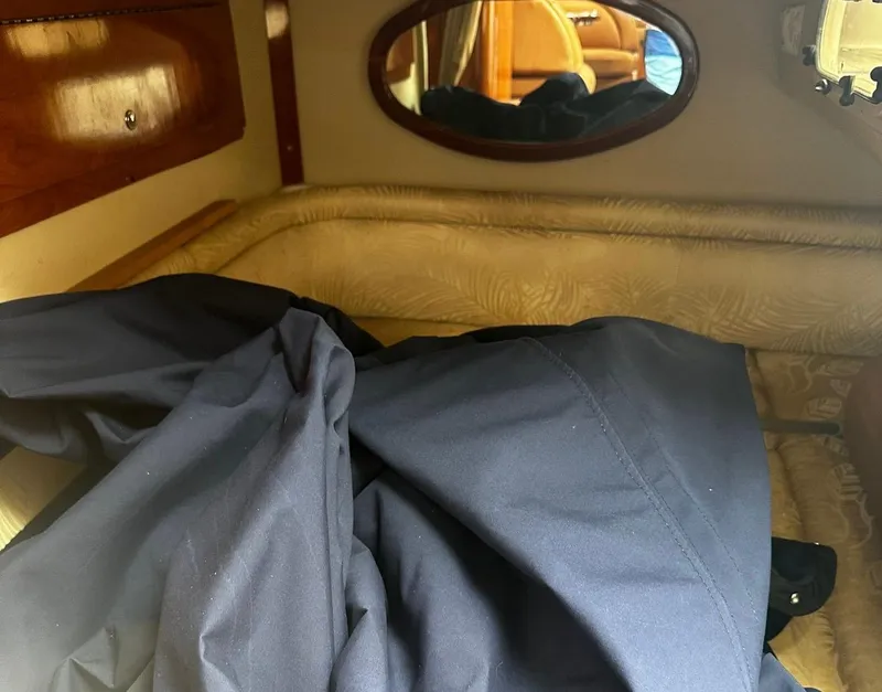 Slide: The Image of 2006 Four Winns 328 Vista cabin interior with bed and mirror. - 35