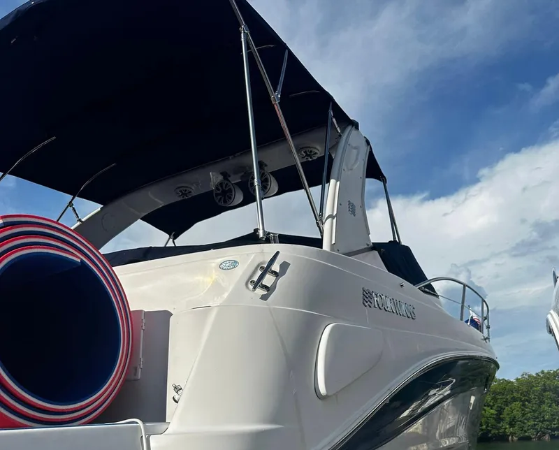 Slide: The Image of 2006 Four Winns 328 Vista boat with canopy on a sunny day. - 8