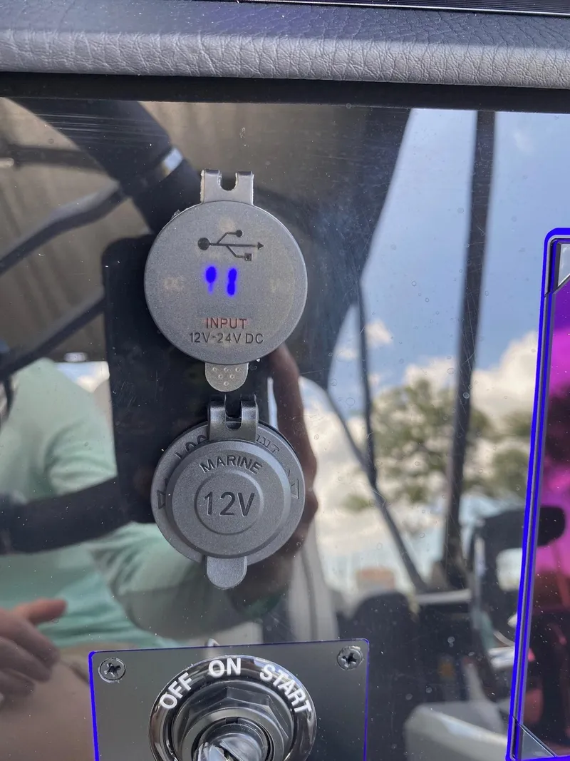 Slide: The Image of Close-up of Viaggio Diamante 24U 2024 boat dashboard with 12V and 12-24V DC outlets. - 15