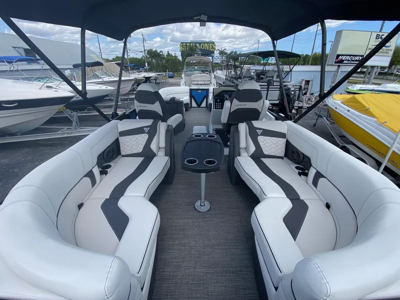 Slide: The Image of 2024 Viaggio Diamante 24U luxury pontoon boat interior with plush seating. - 24