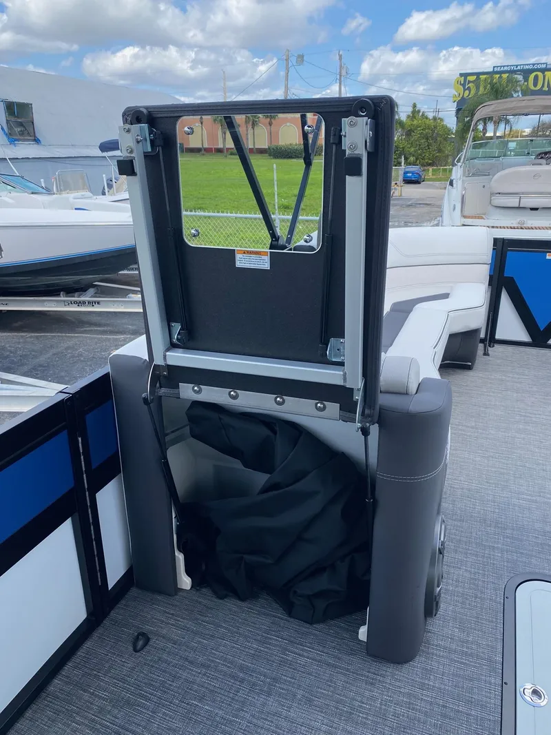 Slide: The Image of 2024 Viaggio Diamante 24U boat interior with foldable seat and storage compartment. - 38