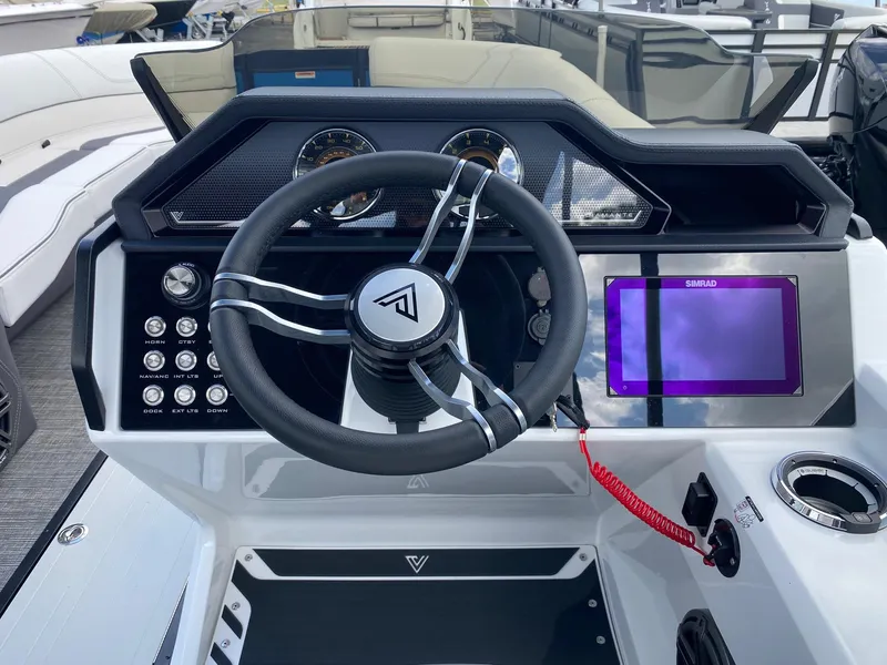 Slide: The Image of 2024 Viaggio Diamante 24U boat dashboard with steering wheel and digital display. - 7