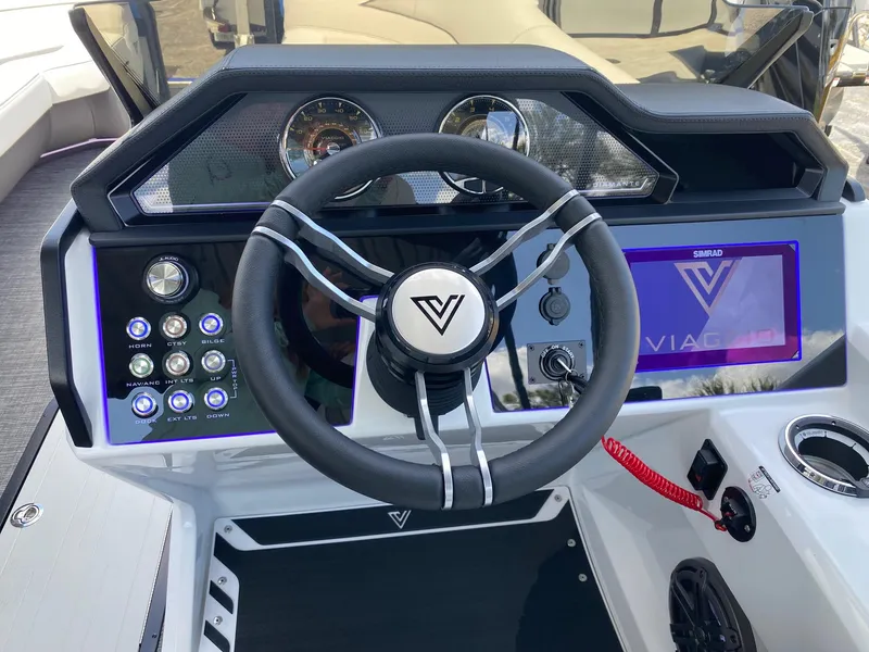 Slide: The Image of 2024 Viaggio Diamante 24U boat dashboard with steering wheel and control panel. - 8