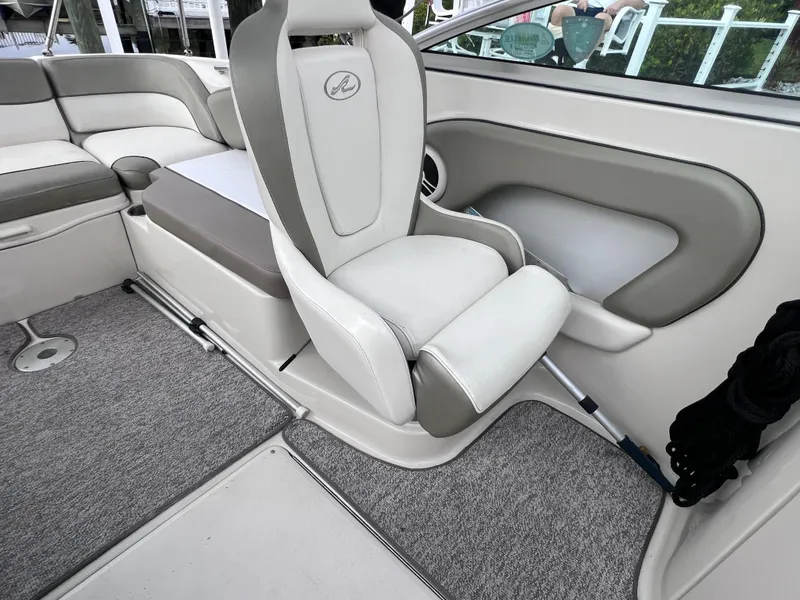 Slide: The Image of Interior of 2007 Sea Ray 240 Sundeck with 2023 motor, featuring plush seating. - 11