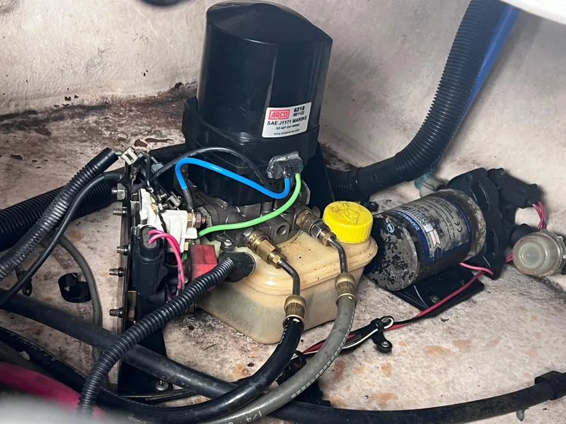 Slide: The Image of Engine compartment of a 2007 Sea Ray 240 Sundeck with 2023 motor. - 27