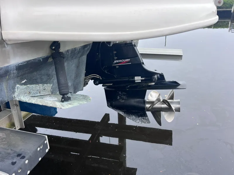 Slide: The Image of Close-up of 2007 Sea Ray 240 Sundeck with 2023 Mercury motor in water. - 3